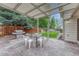 Outdoor patio features a white pergola, grill, privacy fence, and an outdoor seating area at 19149 E Ida Dr, Aurora, CO 80015