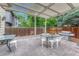 Outdoor patio features a white pergola, grill, privacy fence, and an outdoor seating area at 19149 E Ida Dr, Aurora, CO 80015