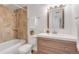 Modern bathroom featuring shower-over-tub, updated vanity, and bronze fixtures at 3613 S Sheridan Blvd # 11, Denver, CO 80235