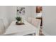 Dining area features a white table with chairs and stylish decorations at 3613 S Sheridan Blvd # 11, Denver, CO 80235