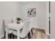 Charming dining area with white table, chairs, and modern decor at 3613 S Sheridan Blvd # 11, Denver, CO 80235