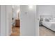 Hallway with bathroom on left and bedroom on right at 3613 S Sheridan Blvd # 11, Denver, CO 80235