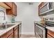 Well-maintained kitchen with stainless steel appliances, updated countertops, and cabinetry at 3613 S Sheridan Blvd # 11, Denver, CO 80235