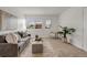 Cozy living room with neutral tones, comfortable furniture, and ample natural light at 3613 S Sheridan Blvd # 11, Denver, CO 80235
