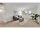 Bright living room featuring modern decor, neutral color palette, and comfortable seating arrangement at 3613 S Sheridan Blvd # 11, Denver, CO 80235
