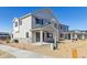 Charming two-story home featuring a covered porch and modern architectural details at 6554 N Malta St, Aurora, CO 80019