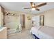 Comfortable bedroom with a ceiling fan and lots of space at 9446 W Wagon Trail Cir, Littleton, CO 80123