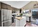 Well-equipped kitchen featuring stainless steel appliances, a functional island, and ample counter space at 9446 W Wagon Trail Cir, Littleton, CO 80123