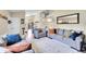 Spacious living room showcasing the hardwood flooring, staircase, and elegant furnishings at 9446 W Wagon Trail Cir, Littleton, CO 80123