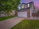 Two story home with a driveway and a two car garage at 9867 Mulberry Way, Highlands Ranch, CO 80129