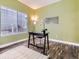 Bright home office with a modern desk, stylish decor, and a large window providing natural light at 9867 Mulberry Way, Highlands Ranch, CO 80129