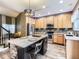 Stylish kitchen featuring an island, granite countertops, stainless steel appliances, and ample cabinetry at 9867 Mulberry Way, Highlands Ranch, CO 80129