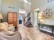 Open-concept home featuring elegant wood floors and a staircase leading to the second level at 9867 Mulberry Way, Highlands Ranch, CO 80129