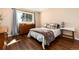 Cozy bedroom with a large window and comfortable furnishings at 24949 N Mountain Park Dr, Evergreen, CO 80439