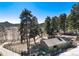 Exterior of property with a small outbuilding and fenced in yard at 24949 N Mountain Park Dr, Evergreen, CO 80439