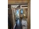Cozy tiny home interior features a sleeping loft, small kitchen, and wood paneled walls at 24949 N Mountain Park Dr, Evergreen, CO 80439