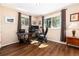 Functional home office with two windows and plenty of space for a desk and storage at 24949 N Mountain Park Dr, Evergreen, CO 80439