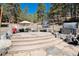 Outdoor patio with seating area, hot tub, and movie screen at 24949 N Mountain Park Dr, Evergreen, CO 80439