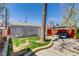 Spacious backyard with lush lawn, brick patio, and privacy fencing for outdoor enjoyment at 4551 Julian St, Denver, CO 80211