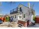 Charming backyard with a hot tub, grill, outdoor seating, and a second story deck at 4551 Julian St, Denver, CO 80211