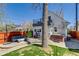 Scenic backyard featuring a patio with furniture, hot tub, and well-maintained lawn at 4551 Julian St, Denver, CO 80211