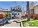 Private backyard featuring a patio seating area, hot tub, and a lush lawn at 4551 Julian St, Denver, CO 80211