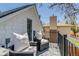 Relaxing balcony offers comfortable seating, views, and a perfect spot for outdoor enjoyment at 4551 Julian St, Denver, CO 80211