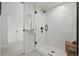 Contemporary bathroom featuring frameless glass shower, bench seating, and modern fixtures at 4551 Julian St, Denver, CO 80211