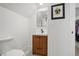 Bathroom featuring a modern vanity with stylish fixtures and an adjoining walk-in closet at 4551 Julian St, Denver, CO 80211