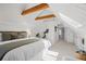 Spacious bedroom with vaulted ceilings, exposed beams, and plenty of natural light at 4551 Julian St, Denver, CO 80211