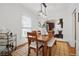 Bright dining room features a dining table and an open layout, connecting to the kitchen beyond at 4551 Julian St, Denver, CO 80211