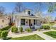White brick home with manicured front yard and decorative bushes at 4551 Julian St, Denver, CO 80211
