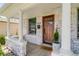 Close-up of front door and porch with charming decor and details at 4551 Julian St, Denver, CO 80211