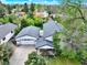 Aerial view of the home showcasing its spacious layout, mature trees, and large two-car garage at 431 N Harlan St, Lakewood, CO 80226