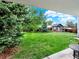 View of backyard with lush green grass and landscaping at 431 N Harlan St, Lakewood, CO 80226