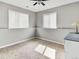 Bedroom featuring carpeted floors, a ceiling fan, and natural light streaming through the windows at 431 N Harlan St, Lakewood, CO 80226