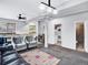 Finished basement featuring two grey chairs and a black leather couch at 431 N Harlan St, Lakewood, CO 80226