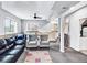 Basement with a leather couch, carpet and natural light from two windows at 431 N Harlan St, Lakewood, CO 80226