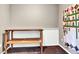 A versatile room with a rustic wooden table and a colorful quilt on the wall at 431 N Harlan St, Lakewood, CO 80226