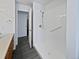 Main bathroom with shower, grab bar and linen closet at 7770 W 90Th Dr, Broomfield, CO 80021