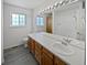 Bathroom with double vanity, large mirror and shower at 7770 W 90Th Dr, Broomfield, CO 80021