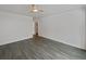 Simple bedroom with gray floors and a ceiling fan at 7770 W 90Th Dr, Broomfield, CO 80021
