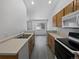 Kitchen with light countertops and wood cabinets at 7770 W 90Th Dr, Broomfield, CO 80021