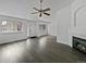 Bright living room with gray floors and a fireplace at 7770 W 90Th Dr, Broomfield, CO 80021