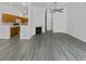 Open concept living room and kitchen with fireplace at 7770 W 90Th Dr, Broomfield, CO 80021