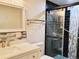 Modern bathroom features updated vanity, toilet, and a glass-enclosed shower at 715 S Alton Way # 10A, Denver, CO 80247