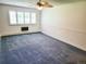 Sunny bedroom features ample natural light from the large window and a ceiling fan at 715 S Alton Way # 10A, Denver, CO 80247