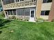 Charming condo featuring a screened patio, flower beds, and a well-maintained lawn at 715 S Alton Way # 10A, Denver, CO 80247