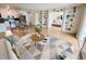 Open-concept living space with a dining area and adjacent bedroom separated by bookshelves at 715 S Alton Way # 10A, Denver, CO 80247