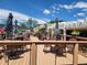 Outdoor deck with tables, chairs, umbrellas, and seating area at 715 S Alton Way # 10A, Denver, CO 80247